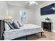 Bright bedroom with a king-size bed and hardwood floors at 2501 N Dundee St, Tampa, FL 33629