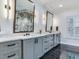 Elegant bathroom with double vanity and black marble floors at 2501 N Dundee St, Tampa, FL 33629