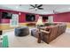 Game room with sectional sofa, large TV, and beanbag chairs at 2501 N Dundee St, Tampa, FL 33629