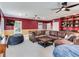 Game room with sectional sofa, built-in shelving, and TV at 2501 N Dundee St, Tampa, FL 33629