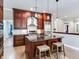 Open kitchen with granite island, stainless steel appliances, and custom cabinetry at 2501 N Dundee St, Tampa, FL 33629