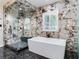 Spa-like bathroom with walk-in shower and soaking tub at 2501 N Dundee St, Tampa, FL 33629