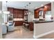 Modern kitchen with dark wood cabinets and stainless steel appliances at 2501 N Dundee St, Tampa, FL 33629