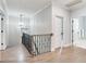Elegant upstairs hallway with hardwood floors and chandelier at 2501 N Dundee St, Tampa, FL 33629