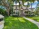 Beautiful two-story house with lush landscaping and a brick pathway at 2501 N Dundee St, Tampa, FL 33629