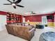 Game room with sectional sofa, built-in shelving, and TV at 2501 N Dundee St, Tampa, FL 33629