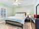 Light and airy bedroom with a king-size bed and ceiling fan at 2501 N Dundee St, Tampa, FL 33629