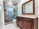 Bathroom with a glass shower and dark wood vanity at 2501 N Dundee St, Tampa, FL 33629