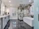Luxurious bathroom with a large shower, soaking tub, and marble floors at 2501 N Dundee St, Tampa, FL 33629