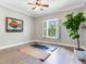 Room with yoga mat and large fiddle leaf fig plant at 2501 N Dundee St, Tampa, FL 33629