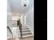 Elegant upstairs hallway with hardwood floors and chandelier at 2501 N Dundee St, Tampa, FL 33629