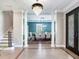 Bright entryway with hardwood floors, chandelier, and view into dining room at 2501 N Dundee St, Tampa, FL 33629