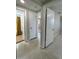 Clean hallway with doors to bedrooms and bathroom at 2120 Hess Dr, Holiday, FL 34691