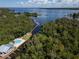 Aerial view of waterfront property with private boat dock and pool at 2511 Dolly Bay Dr # 301, Palm Harbor, FL 34684