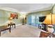 Living room with sliding doors to a screened balcony, offering ample natural light at 2511 Dolly Bay Dr # 301, Palm Harbor, FL 34684