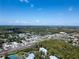 Wide aerial view of a residential area with highway and water access at 2511 Dolly Bay Dr # 301, Palm Harbor, FL 34684