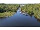 Aerial view of a boat dock with several boats and lush green vegetation at 2511 Dolly Bay Dr # 301, Palm Harbor, FL 34684