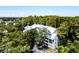 Aerial view of a multi-unit building nestled in lush greenery at 2511 Dolly Bay Dr # 301, Palm Harbor, FL 34684