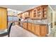 Well-lit kitchen with light wood cabinets and granite countertops at 2511 Dolly Bay Dr # 301, Palm Harbor, FL 34684