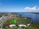 Aerial view showing location of condo community near a highway and lake at 2511 Dolly Bay Dr # 301, Palm Harbor, FL 34684