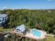 Aerial view of community pool, clubhouse, and private boat docks at 2511 Dolly Bay Dr # 301, Palm Harbor, FL 34684