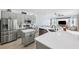 Modern kitchen featuring stainless steel appliances, quartz countertops, and an island at 13049 Thoroughbred Dr, Dade City, FL 33525