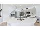 Modern kitchen with quartz countertops, stainless steel appliances, and stylish gray cabinetry at 13049 Thoroughbred Dr, Dade City, FL 33525