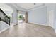 Bright living room with tile floors, sliding glass doors, and neutral paint at 13049 Thoroughbred Dr, Dade City, FL 33525