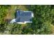 Single story house with a dark gray roof, viewed from above at 3111 Arrowsmith Rd, Wimauma, FL 33598