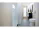 Modern bathroom with patterned floor and walk-in shower at 3111 Arrowsmith Rd, Wimauma, FL 33598