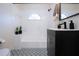 Modern bathroom with patterned floor and updated vanity at 3111 Arrowsmith Rd, Wimauma, FL 33598