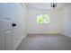 Bright bedroom featuring a window and a double door closet at 3111 Arrowsmith Rd, Wimauma, FL 33598