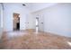 Bedroom with tile floors, access to bathroom and another room at 3111 Arrowsmith Rd, Wimauma, FL 33598