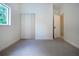Empty bedroom with carpet, window and closet at 3111 Arrowsmith Rd, Wimauma, FL 33598