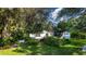 Charming house with lush landscaping and a peaceful garden at 3111 Arrowsmith Rd, Wimauma, FL 33598