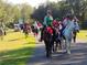 Group horseback riding on trail at 3111 Arrowsmith Rd, Wimauma, FL 33598