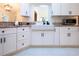 Modern kitchen showcasing a farmhouse sink and granite countertops at 3111 Arrowsmith Rd, Wimauma, FL 33598