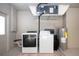 Laundry room with washer, dryer and water heater at 3111 Arrowsmith Rd, Wimauma, FL 33598