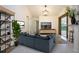 Spacious living room featuring a comfortable sofa and large TV at 3111 Arrowsmith Rd, Wimauma, FL 33598