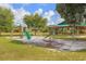 Community playground with playset and swings at 3111 Arrowsmith Rd, Wimauma, FL 33598