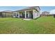 Large backyard with covered patio and fenced area at 30425 Pecan Valley Loop, Wesley Chapel, FL 33543