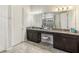 Spa-like Primary bathroom with double vanity and large mirror at 30425 Pecan Valley Loop, Wesley Chapel, FL 33543