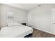 Bedroom with king-size bed and wood-look flooring at 30425 Pecan Valley Loop, Wesley Chapel, FL 33543