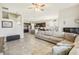 Open concept living room with views of kitchen and staircase at 30425 Pecan Valley Loop, Wesley Chapel, FL 33543