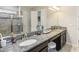 Double vanity and large mirror in Primary bathroom at 30425 Pecan Valley Loop, Wesley Chapel, FL 33543