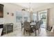 Bright breakfast nook features a round table and chairs, with access to the backyard at 30425 Pecan Valley Loop, Wesley Chapel, FL 33543