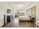 Bright Primary bedroom with a king-size bed and large windows at 30425 Pecan Valley Loop, Wesley Chapel, FL 33543