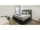 Spacious bedroom with king-size bed and a home office at 30425 Pecan Valley Loop, Wesley Chapel, FL 33543