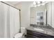 Bathroom with shower/tub combo and granite vanity at 30425 Pecan Valley Loop, Wesley Chapel, FL 33543