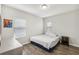 Bedroom with king-size bed and wood-look flooring at 30425 Pecan Valley Loop, Wesley Chapel, FL 33543